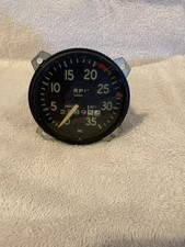 vintage aircraft tach with hour